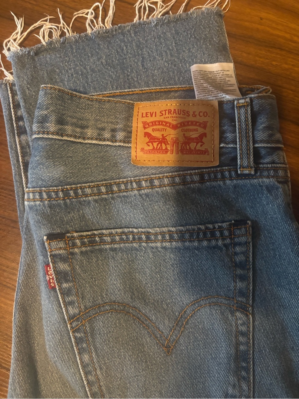Levi's Women High-Rise Light Blue Denim Jeans with Frayed Hem